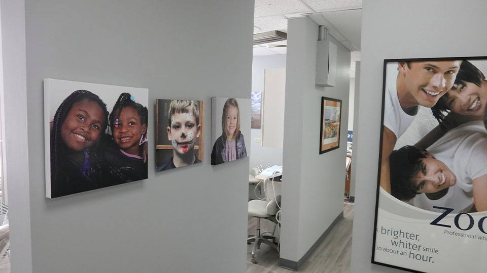 Patient images on hallway wall